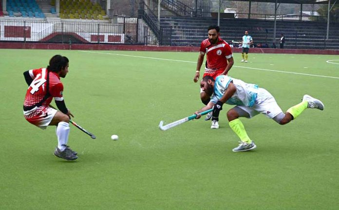 A view of the hockey match between Mardan and Mansehra teams at Qayum Sports Complex