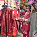 Students are visiting stalls during Punjabi Cultural Day and the 5th Annual Book Fair at Government College Women University Faisalabad (GCWUF)