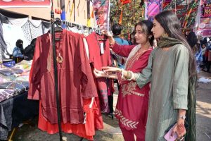 Students are visiting stalls during Punjabi Cultural Day and the 5th Annual Book Fair at Government College Women University Faisalabad (GCWUF)