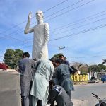 Cantonment Board workers install a statue of Quaid-e-Azam at Club Chowk, honoring the nation’s founder.