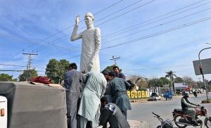 Cantonment Board workers install a statue of Quaid-e-Azam at Club Chowk, honoring the nation’s founder.