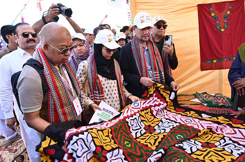 Female visit a stall at the Sindh Peoples Housing for Flood Affected (SPHF) project at village Himmatabad