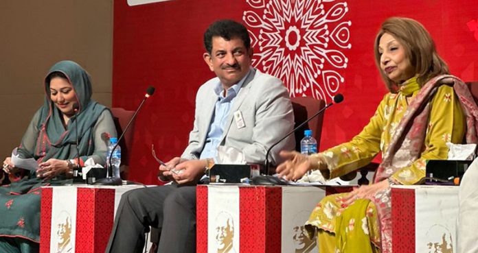 Federal Secretary National Heritage and Culture Asadur Rehman Gilani with participants at a book launch event on the theme of culture at Faiz Festival at Al-Hamrah Hall