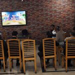 People watch and enjoy the T20 cricket match between Pakistan and India on TV screen in the Provincial Capital