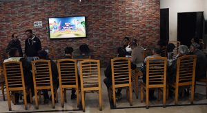 People watch and enjoy the T20 cricket match between Pakistan and India on TV screen in the Provincial Capital