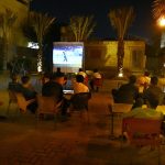 People watch and enjoy the T20 cricket match between Pakistan and India on big screen at defense area