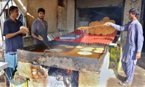 Customers crowd date stalls at Tower Market, a special item for iftar, as people prepare to break their fast ahead of the Holy Month of Ramazan