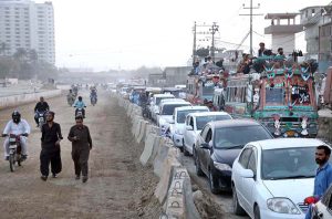 A view of a heavy traffic jam during Iftar time near the under-construction Red Line Bus Project on Karachi University Road.