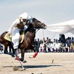 A horse riders competes during a tent pegging competition of 21st TDCP Cholistan Desert Rally 2026 at Cholistan desert Jeep Rally