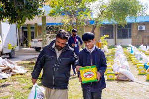 School children after receiving their part during Rashan Distribution by Allah Wale Foundation at National Special Education Centre for Hearing Impaired Children