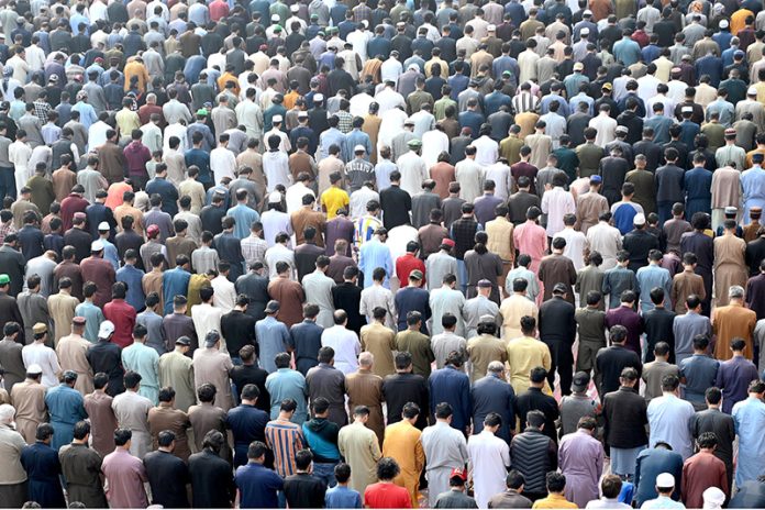 Muslim worshippers offer the first Friday prayers of the holy month of Ramazan at the historic Masjid Wazir Khan