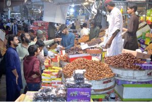 Customers crowd date stalls at Tower Market, a special item for iftar, as people prepare to break their fast ahead of the Holy Month of Ramazan