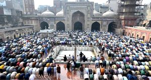 Muslim worshippers offer the first Friday prayers of the holy month of Ramazan at the historic Masjid Wazir Khan