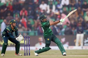Australian players celebrate after the dismissal of Pakistan's (Salman Agha catch Green ball by Dwarshuis) during the third Twenty20 international cricket match between Pakistan and Australia at the Gaddafi Cricket Stadium