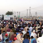 People break their fast during Free Iftar organized by Allah Wale Foundation on the first day of holy fasting month of Ramazan at Islamabad Expressway