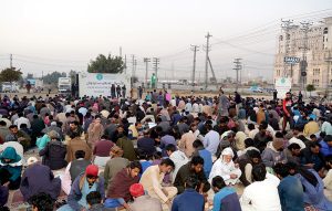 People break their fast during Free Iftar organized by Allah Wale Foundation on the first day of holy fasting month of Ramazan at Islamabad Expressway