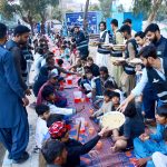 Volunteers distribute free Iftar for the common people to break their fast in the Islamic holy month of Ramazan, at Latifabad