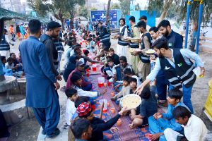 Volunteers distribute free Iftar for the common people to break their fast in the Islamic holy month of Ramazan, at Latifabad