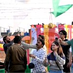 People enjoy flying kites during celebrations of the three-day kite-flying festival “Basant” in the Walled City, marking its return to the provincial capital after two decades under strict administrative control