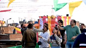 People enjoy flying kites during celebrations of the three-day kite-flying festival “Basant” in the Walled City, marking its return to the provincial capital after two decades under strict administrative control