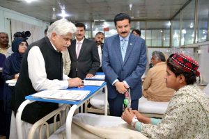 Governor Khyber Pakhtunkhwa Faisal Karim Kundi inquires about the health of patients during a visit to the Pak Red Crescent Medical and Dental College