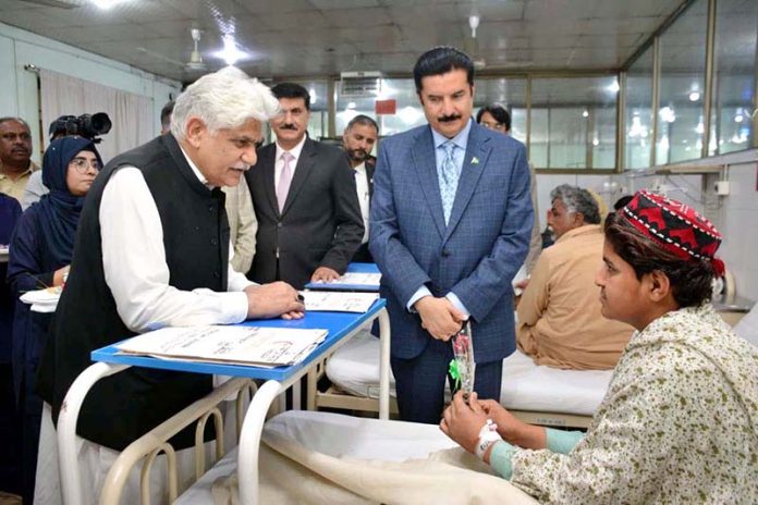 Governor Khyber Pakhtunkhwa Faisal Karim Kundi inquires about the health of patients during a visit to the Pak Red Crescent Medical and Dental College