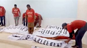 Dead bodies of the victims of an accident on a highway involving a passenger bus and a truck. At least 12 people, including women and children, are dead and several others injured in a multi-vehicle collision involving an oil tanker, a passenger bus, and other cars near Kathore.