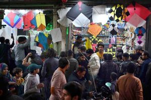 A large number of people selecting and purchasing the kites to celebrate the upcoming three-day kite flying festival (Basant) at local market in the Provincial Capital.