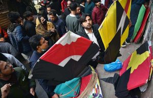 A large number of people selecting and purchasing the kites to celebrate the upcoming three-day kite flying festival (Basant) at local market in the Provincial Capital.