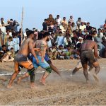 Players in action during Takreem Shuhada kabaddi match as spectators gather in large numbers to witness the traditional sport at a local ground