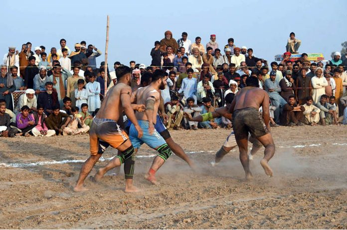 Players in action during Takreem Shuhada kabaddi match as spectators gather in large numbers to witness the traditional sport at a local ground