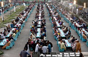 A large number of people wait for the Maghrib Azan before breaking their fast during Iftar meals in the holy fasting month of Ramzan