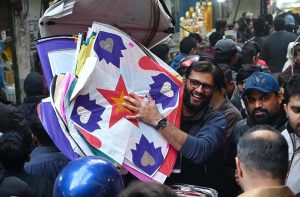 A large number of people selecting and purchasing the kites to celebrate the upcoming three-day kite flying festival (Basant) at local market in the Provincial Capital.