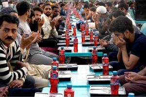 A large number of people wait for the Maghrib Azan before breaking their fast during Iftar meals in the holy fasting month of Ramzan