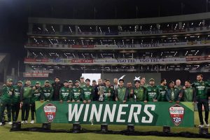 Pakistani players and management pose for a group photograph with PCB Chairman Mohsin Naqvi after winning the series and the third Twenty20 international against Australia at Gaddafi Stadium
