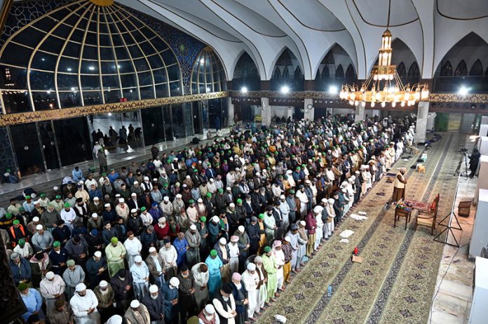 A large number of worshipers offering Namaz-e- Tarawih after sighting the moon and the first prayers marking the start of the Islamic holy fasting month of Ramazan at Data Darbar mosque