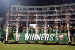 Pakistani players and management pose for a group photograph with PCB Chairman Mohsin Naqvi after winning the series and the third Twenty20 international against Australia at Gaddafi Stadium