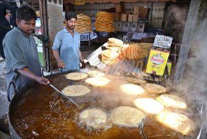 Workers busy in preparing vermicelli (Pheoni) ahead of Ramadan-ul-Mubarak at his workplace near Bakrani Road.