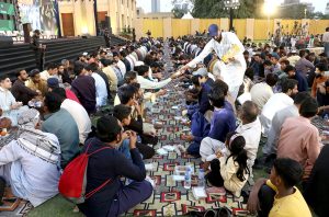 A large number of people break their fast during Iftar dinner reception to the common people under Umeed Ramazan at the Governor's House