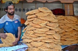 Workers busy in preparing vermicelli (Pheoni) ahead of Ramadan-ul-Mubarak at his workplace near Bakrani Road.