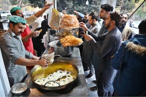 A vendor preparing traditional food item Pakora (fritter) for Iftar in the holy fasting month of Ramazan at I-10 Markaz
