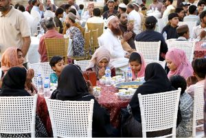 A large number of people break their fast during Iftar dinner reception to the common people under Umeed Ramazan at the Governor's House
