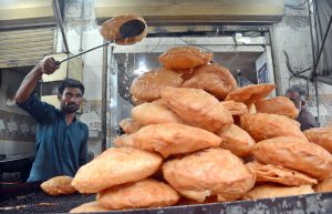 Workers busy in preparing vermicelli (Pheoni) ahead of Ramadan-ul-Mubarak at his workplace near Bakrani Road.