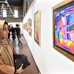 Visitors observe intricate artworks at the calligraphy exhibition “ABJAD 26” by Dr. Mahmood Nasir Malik at NCA Tollinton Block.