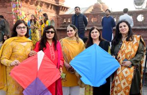 Female teachers participating in the Basant Festival organized by Punjab University College of Art and Design hold kites during the festival’s return to the provincial capital after the ban was lifted after two decades