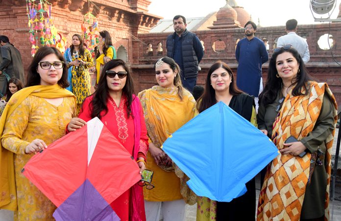 Female teachers participating in the Basant Festival organized by Punjab University College of Art and Design hold kites during the festival’s return to the provincial capital after the ban was lifted after two decades