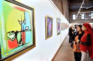 Visitors observe intricate artworks at the calligraphy exhibition “ABJAD 26” by Dr. Mahmood Nasir Malik at NCA Tollinton Block.