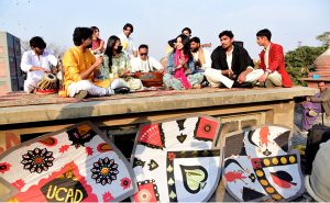 Female teachers participating in the Basant Festival organized by Punjab University College of Art and Design hold kites during the festival’s return to the provincial capital after the ban was lifted after two decades