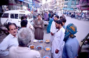 A vendor prepare Jalebi to sell for Iftar at Burns Road