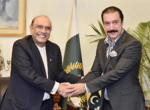 President Asif Ali Zardari shaking hands with Raja Faisal Mumtaz Rathore, Prime Minister of Azad Jammu and Kashmir, at Aiwan-e-Sadr.